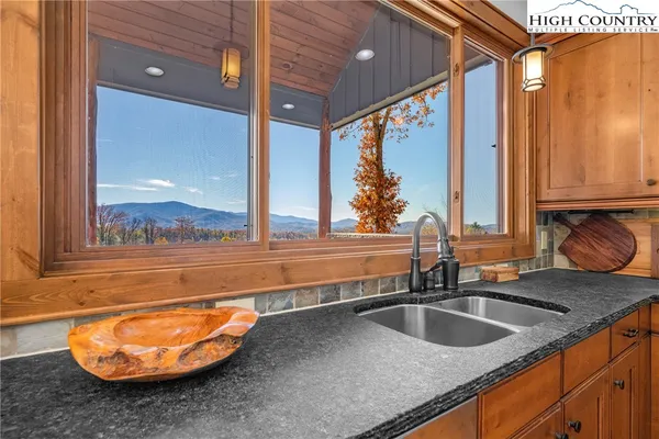 a kitchen with a sink and a window
