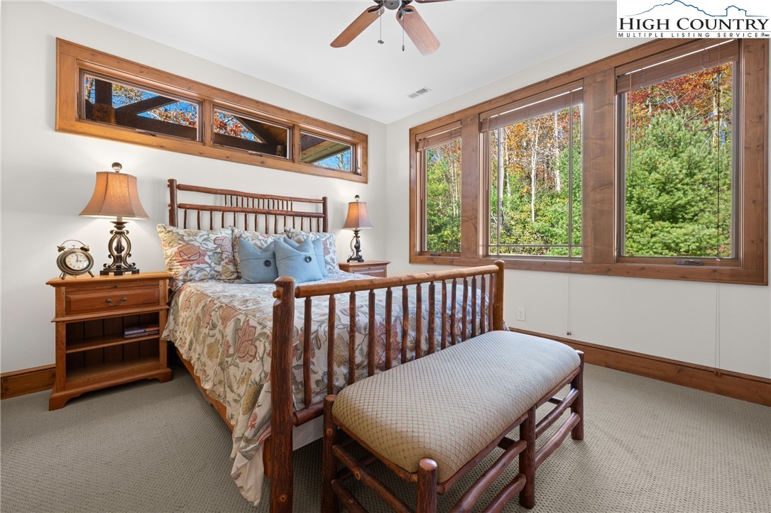 138 Springhouse Drive, Unit C2 Elk Park, NC 28622 - Photo 21 of 44 a bedroom with furniture and a window