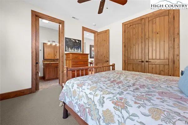 a bedroom with a bed and cabinets
