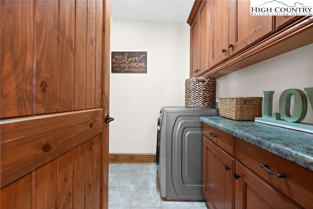 138 Springhouse Drive, Unit C2 Elk Park, NC 28622 - Photo 23 of 44 a kitchen with a refrigerator and cabinets