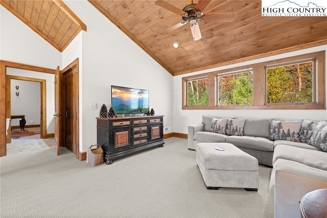 138 Springhouse Drive, Unit C2 Elk Park, NC 28622 - Photo 25 of 44 a living room with furniture and a flat screen tv