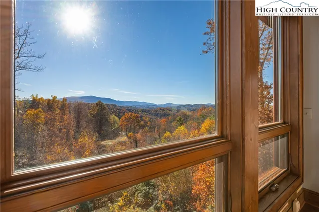 a view of a swimming pool with a yard