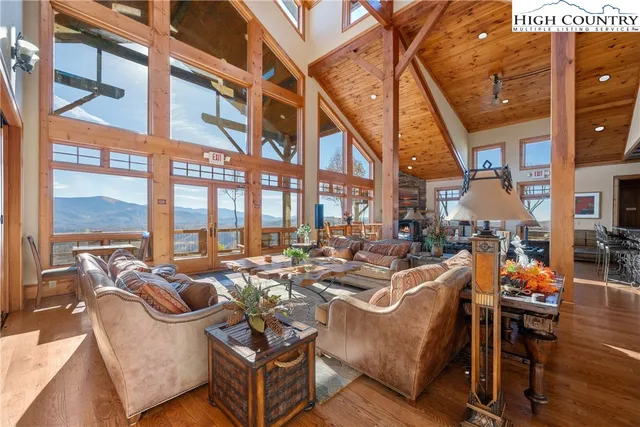 a view of a livingroom with workspace and a window