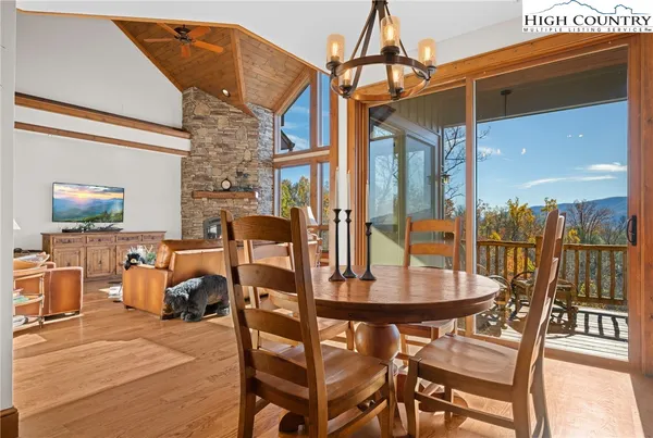 a dining room with furniture and wooden floor