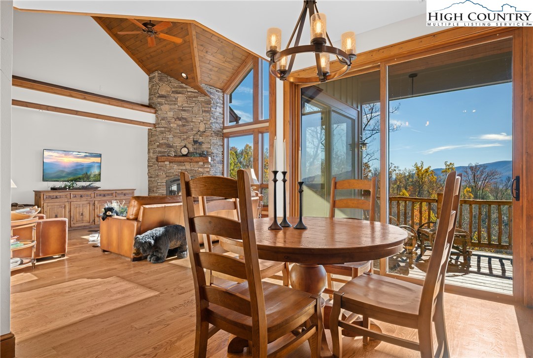 138 Springhouse Drive, Unit C2 Elk Park, NC 28622 - Photo 5 of 44 a dining room with furniture and wooden floor