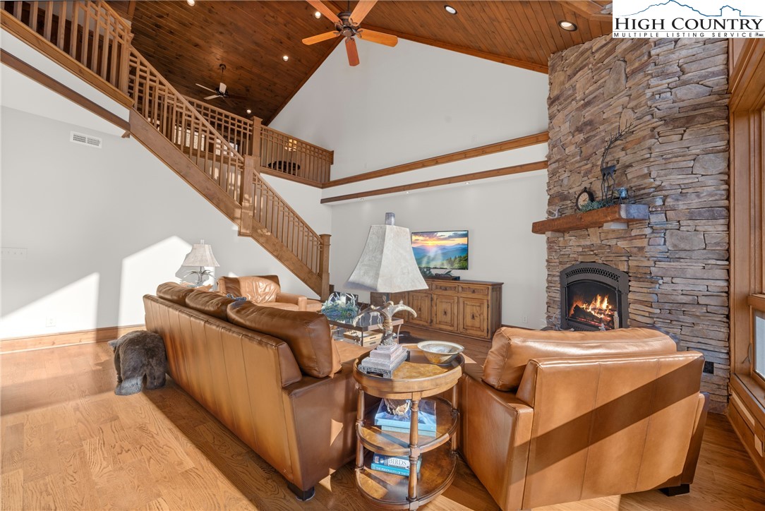 138 Springhouse Drive, Unit C2 Elk Park, NC 28622 - Photo 10 of 44 a living room with fireplace furniture and a wooden floor