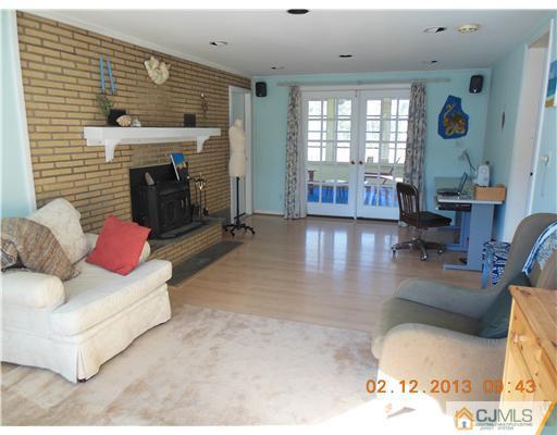 25 Penn Lyle Road West Windsor, NJ 08550 - Photo 12 of 25 a living room with furniture and a fireplace