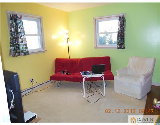 25 Penn Lyle Road West Windsor, NJ 08550 - Photo 15 of 25 a living room with furniture and a window