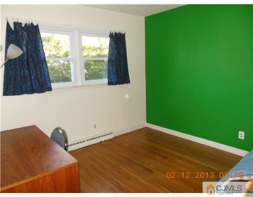 25 Penn Lyle Road West Windsor, NJ 08550 - Photo 16 of 25 a view of wooden floor and windows in a room