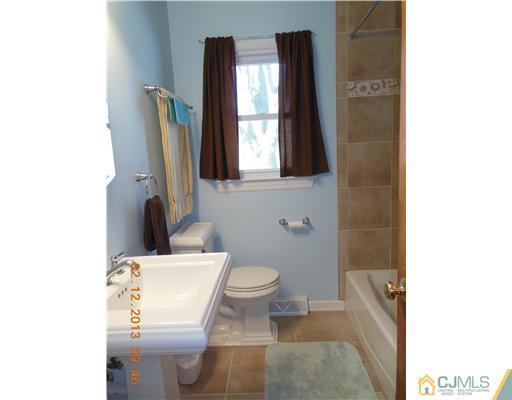 25 Penn Lyle Road West Windsor, NJ 08550 - Photo 19 of 25 a bathroom with a toilet sink and mirror