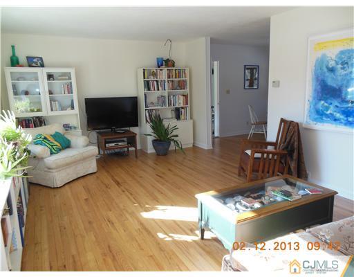 25 Penn Lyle Road West Windsor, NJ 08550 - Photo 4 of 25 a living room with furniture and a flat screen tv
