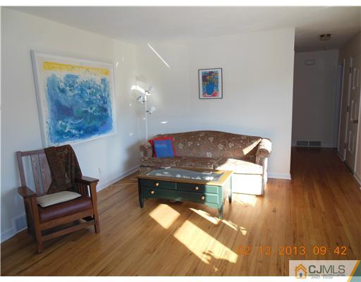 25 Penn Lyle Road West Windsor, NJ 08550 - Photo 6 of 25 a living room with furniture and a wooden floor