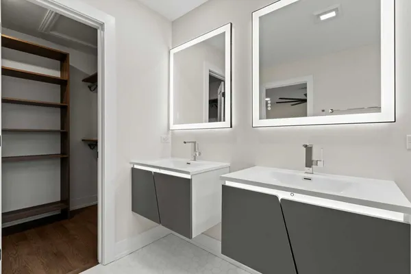 a spacious bedroom with a bed and a table