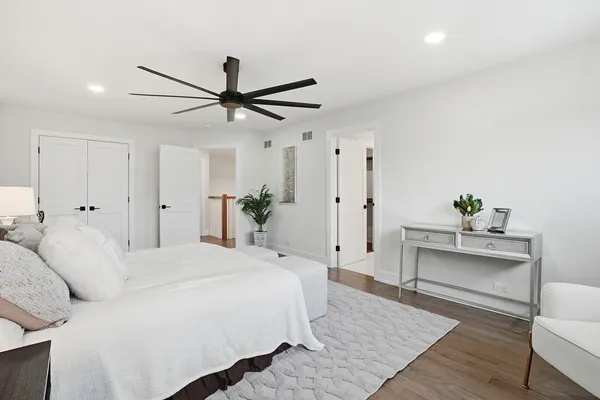 a bathroom with a bathtub sink mirror and toilet