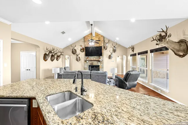 a spacious bedroom with a bed and a large window