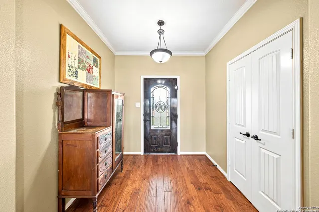 a bedroom with a bed dresser and a window