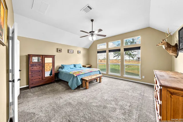 a bed room with a bed and a chandelier