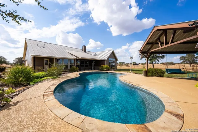 an aerial view of a house having outdoor seating