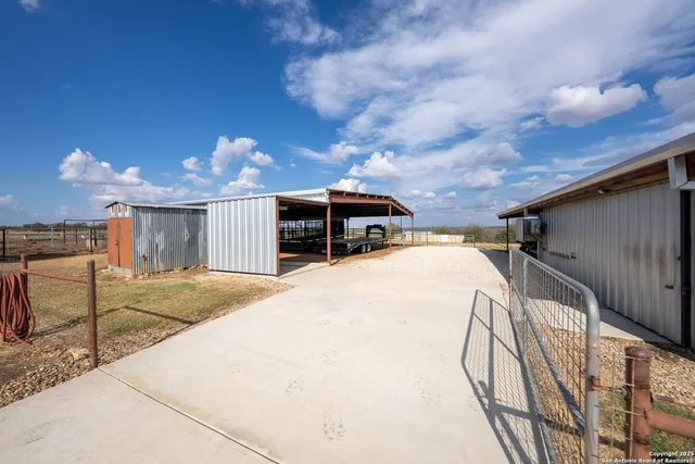 a view of a swimming pool with an outdoor space and seating area
