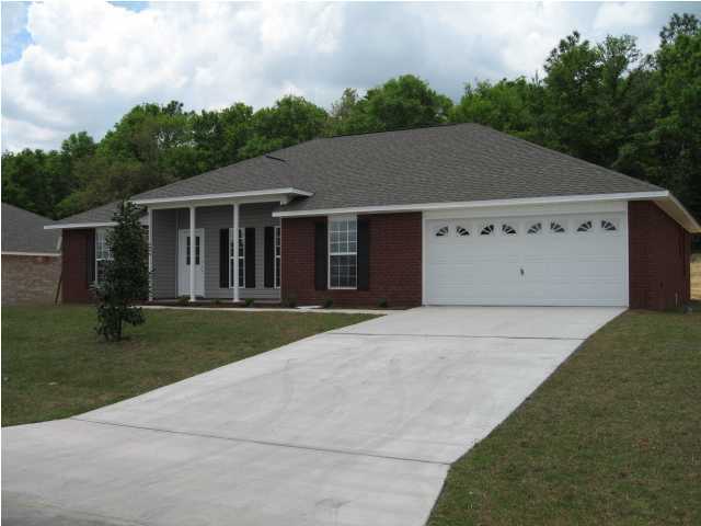 5216 Moore Loop Crestview, FL 32536 - Photo 1 of 5 front view of a house with a yard