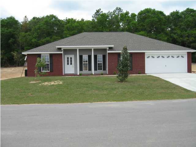 5216 Moore Loop Crestview, FL 32536 - Photo 2 of 5 a aerial view of a house next to yard and road