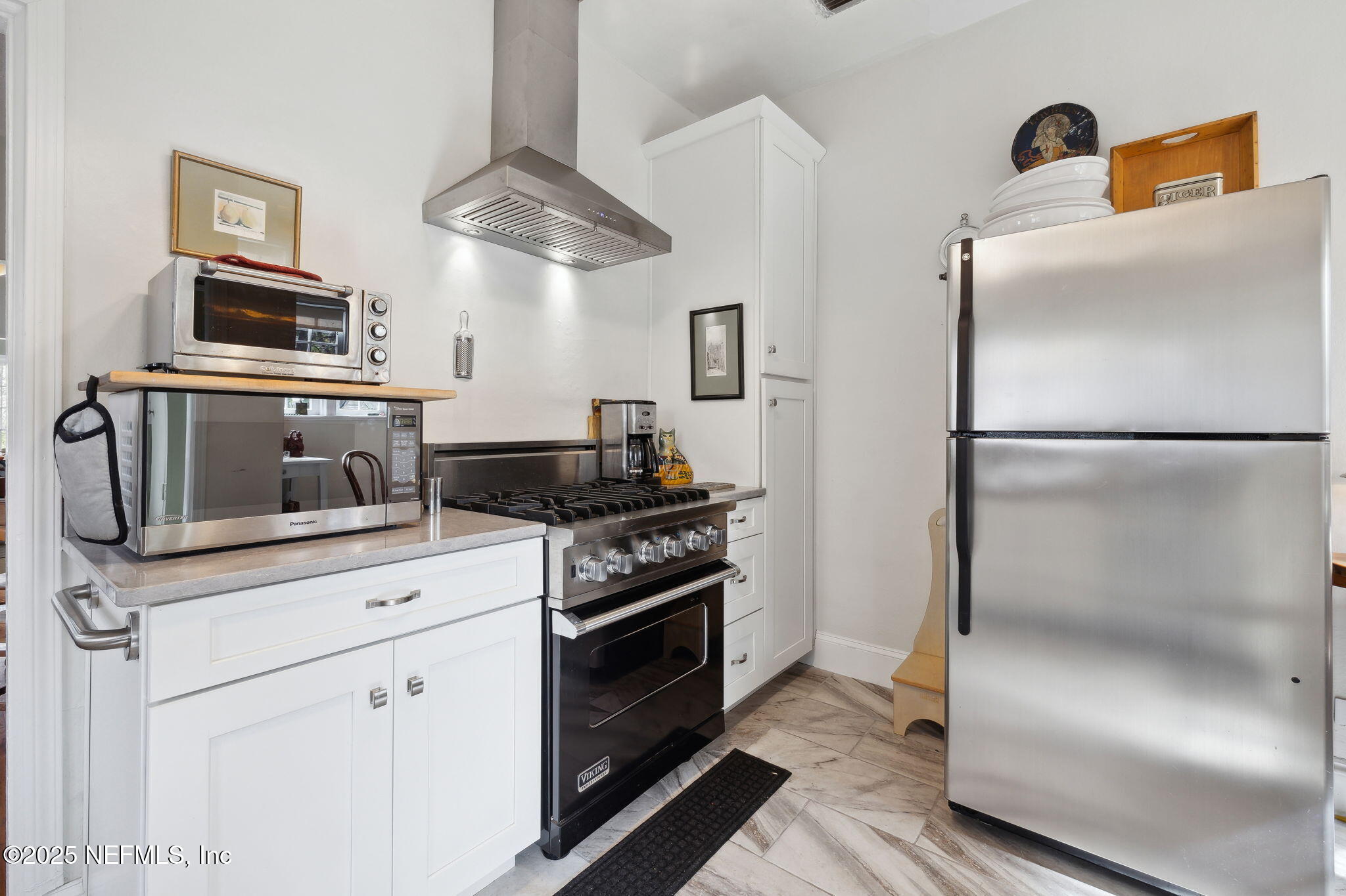 4608 Post Street Jacksonville, FL 32205 - Photo 15 of 49 a kitchen with cabinets and steel stainless steel appliances