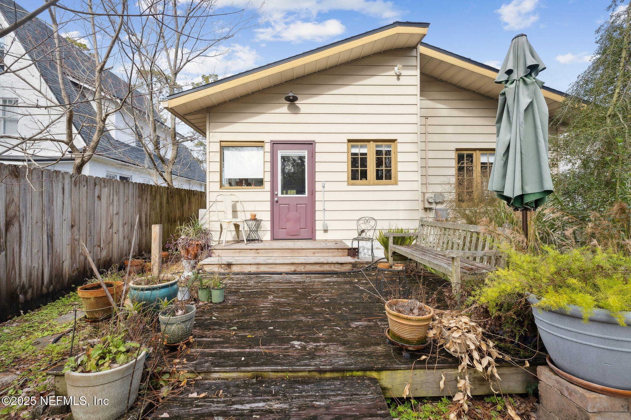 4608 Post Street Jacksonville, FL 32205 - Photo 26 of 49 a view of a back yard of the house with a chair