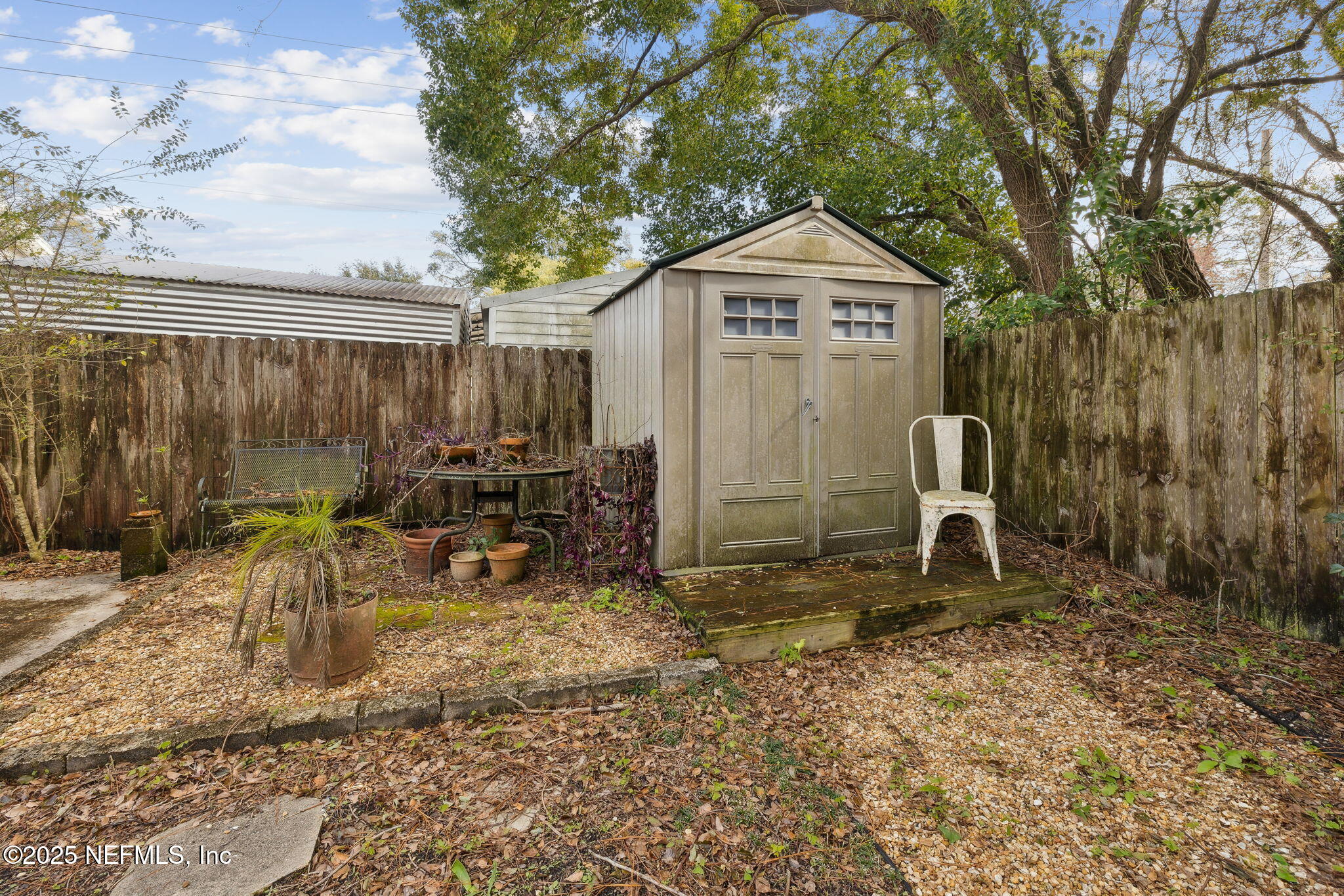 4608 Post Street Jacksonville, FL 32205 - Photo 29 of 49 a view of a chairs and table in the backyard