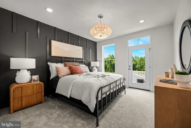 a spacious bedroom with a bed and a lamp