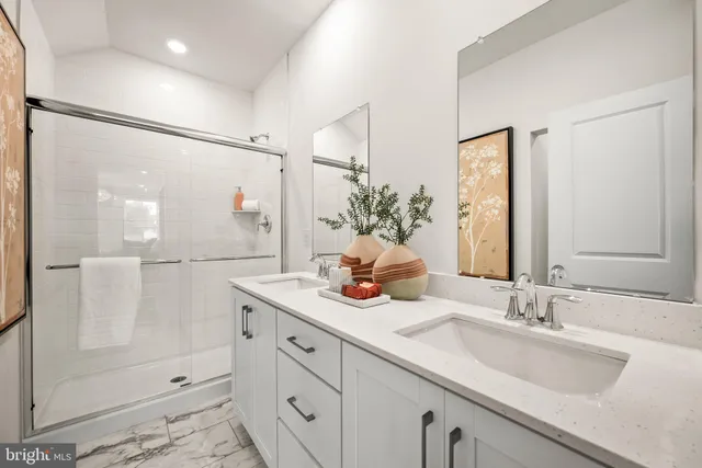 a bathroom with a granite countertop sink mirror and double