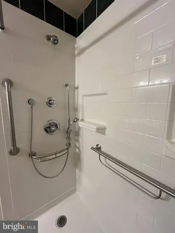 a view of backyard with barbeque grill and wooden fence