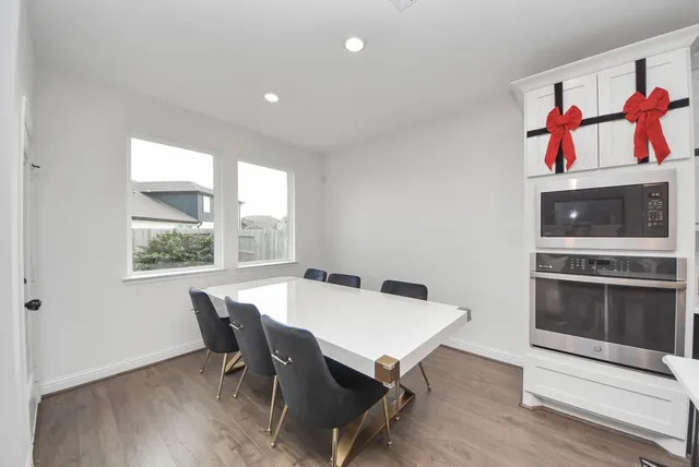 a view of a dining room with furniture and window