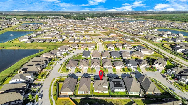 an aerial view of residential building and car parked
