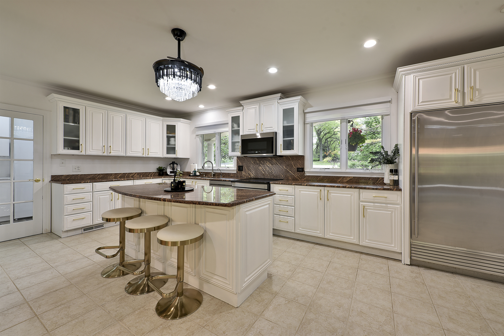 144 North Highland Road Inverness, IL 60067 - Photo 8 of 49 a kitchen with stainless steel appliances granite countertop a sink a stove a refrigerator cabinets and a dining table