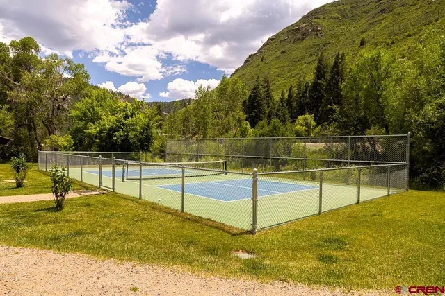 a view of swimming pool with a garden