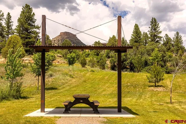 a view of a balcony with two chairs