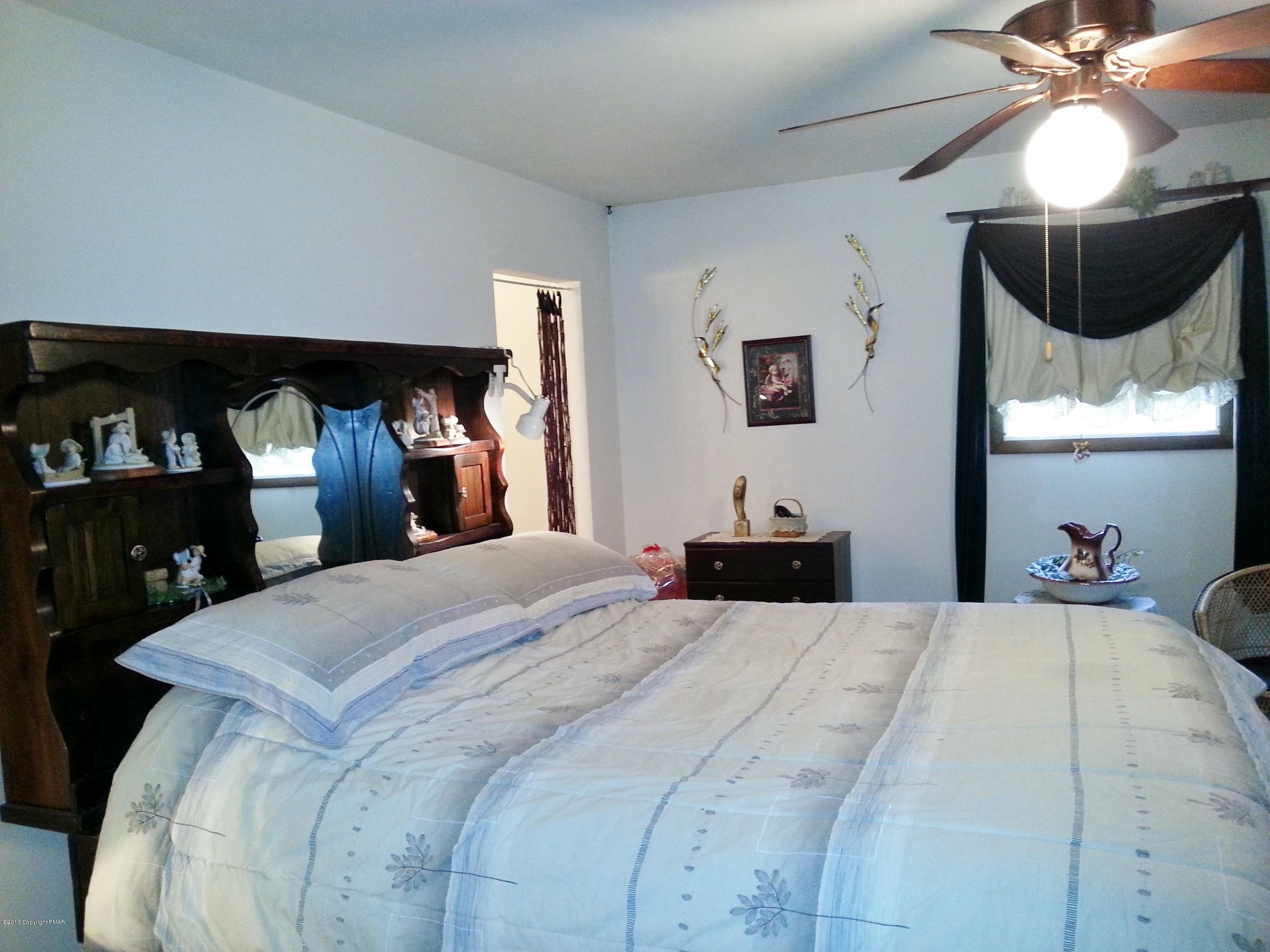 2187 Shafer Road Stroudsburg, PA 18360 - Photo 11 of 29 a bedroom with a bed and a mirror