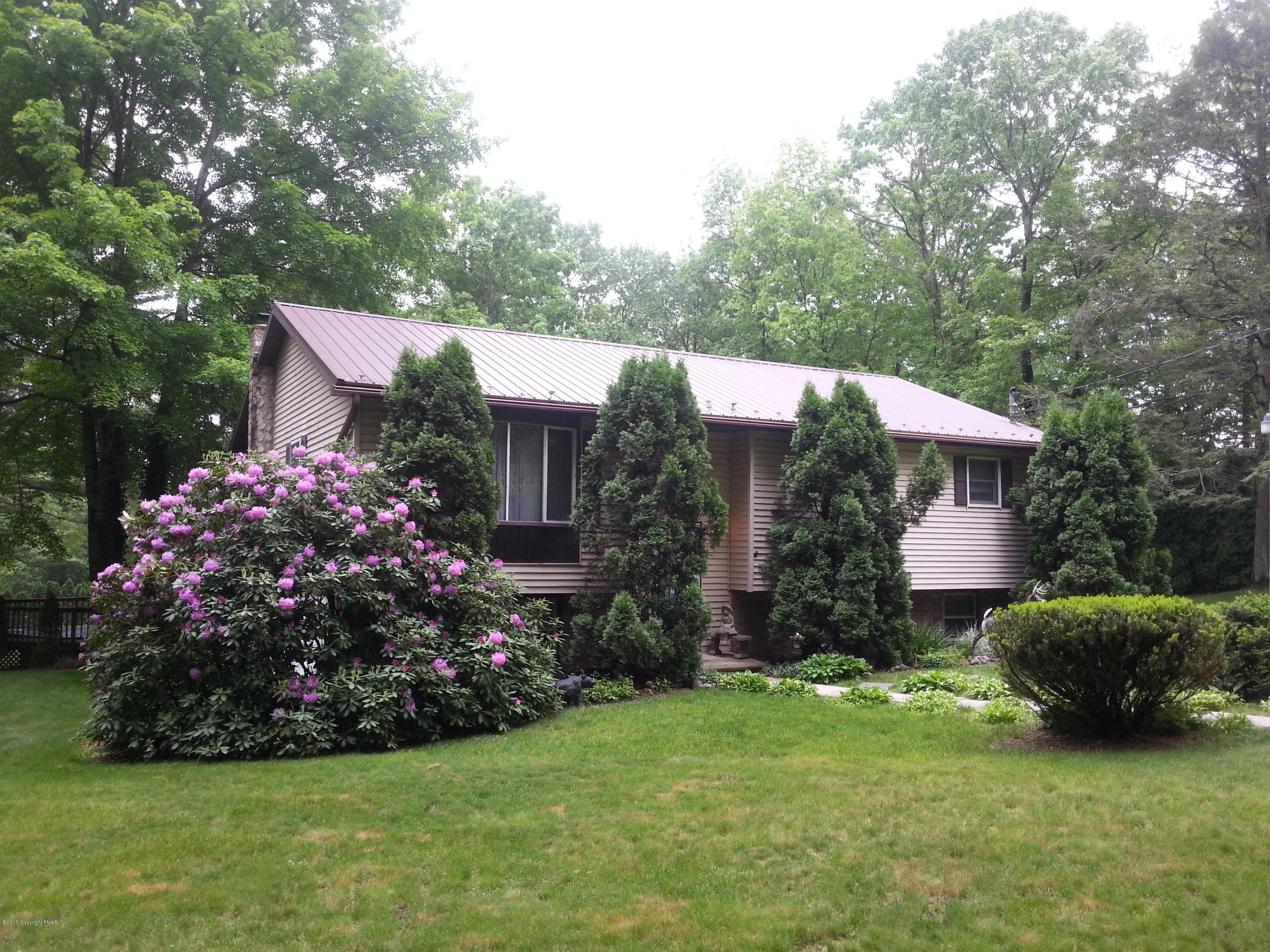 2187 Shafer Road Stroudsburg, PA 18360 - Photo 2 of 29 a view of a house with a garden and plants