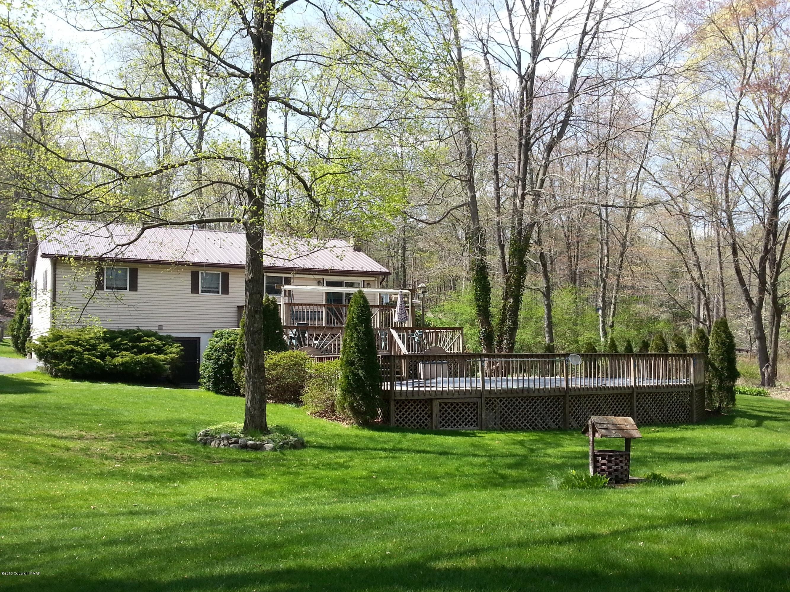 2187 Shafer Road Stroudsburg, PA 18360 - Photo 21 of 29 a front view of a house with garden and a tree