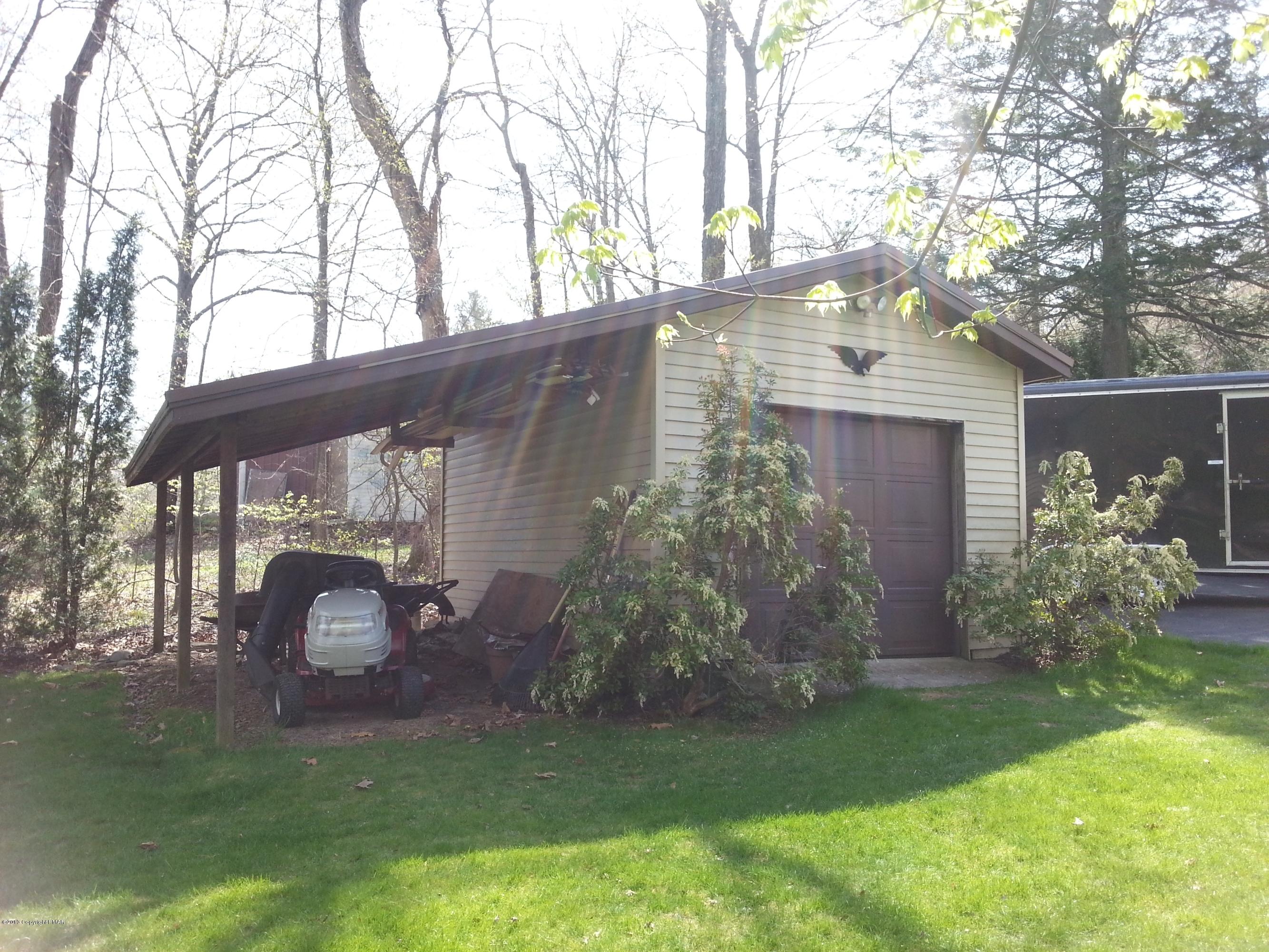 2187 Shafer Road Stroudsburg, PA 18360 - Photo 25 of 29 a front view of a house with garden