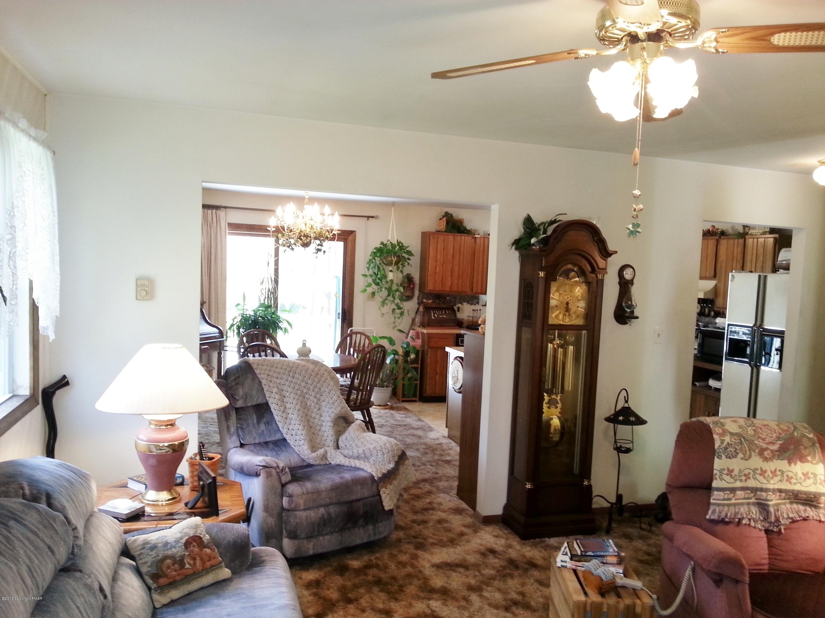 2187 Shafer Road Stroudsburg, PA 18360 - Photo 4 of 29 a living room with furniture chandelier and a window