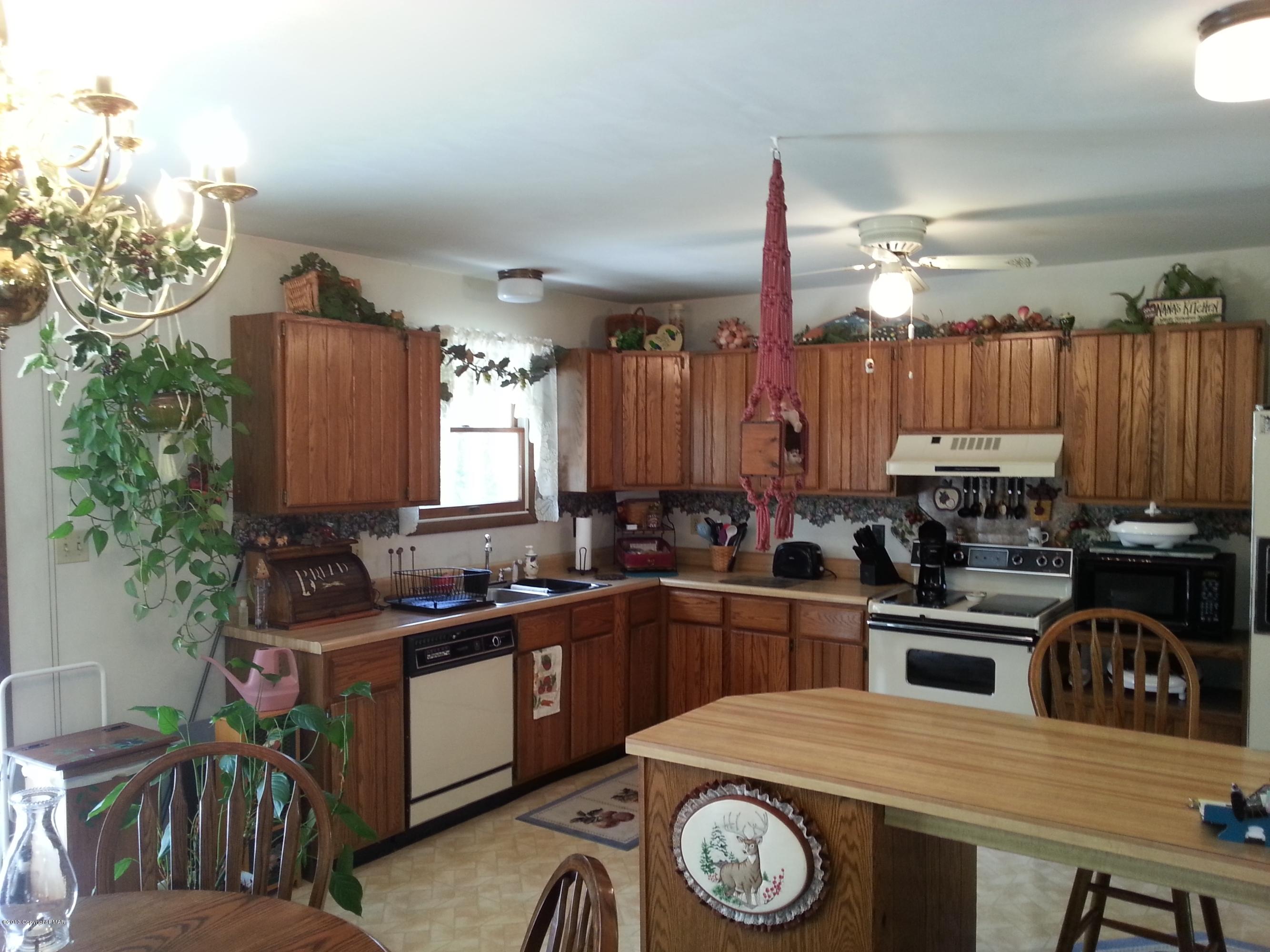 2187 Shafer Road Stroudsburg, PA 18360 - Photo 5 of 29 a kitchen with a sink a stove and cabinets