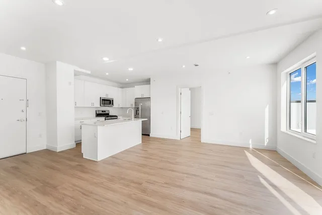 a view of kitchen with wooden floor