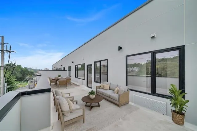 a outdoor living space with furniture and garden view