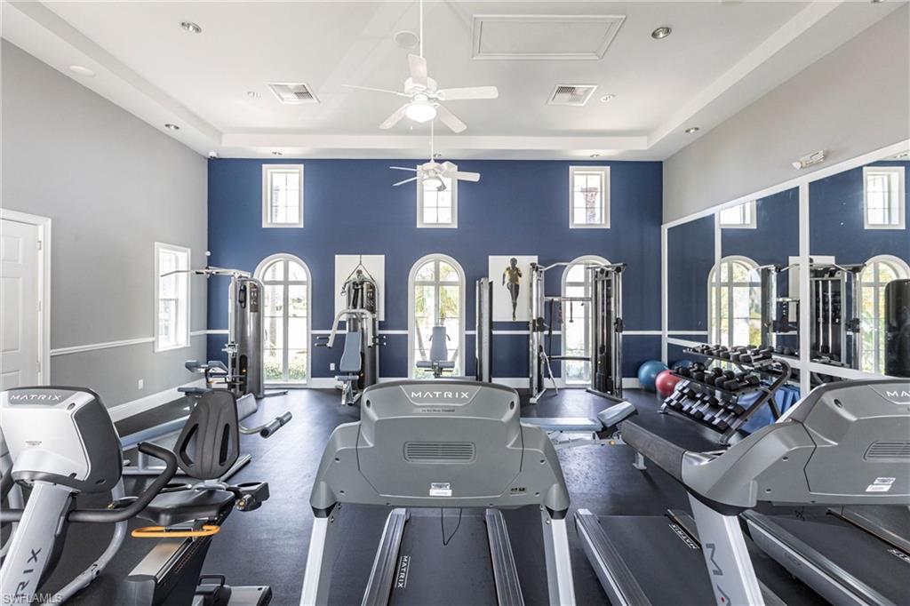 4565 Waterscape Lane Fort Myers, FL 33966 - Photo 33 of 42 Exercise room featuring visible vents, ceiling fan, and plenty of natural light
