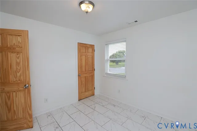 an empty room with windows