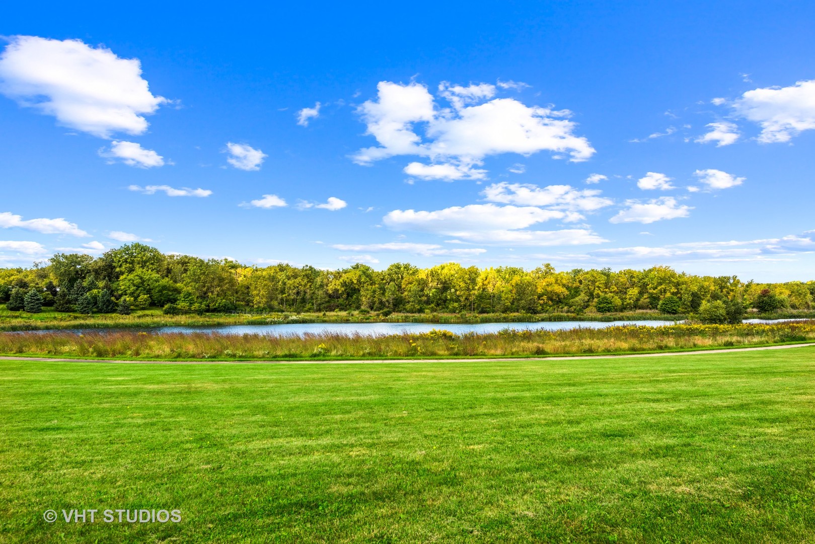 1205 Prairie View Parkway Cary, IL 60013 - Photo 14 of 14 a view of a lake with houses in the background