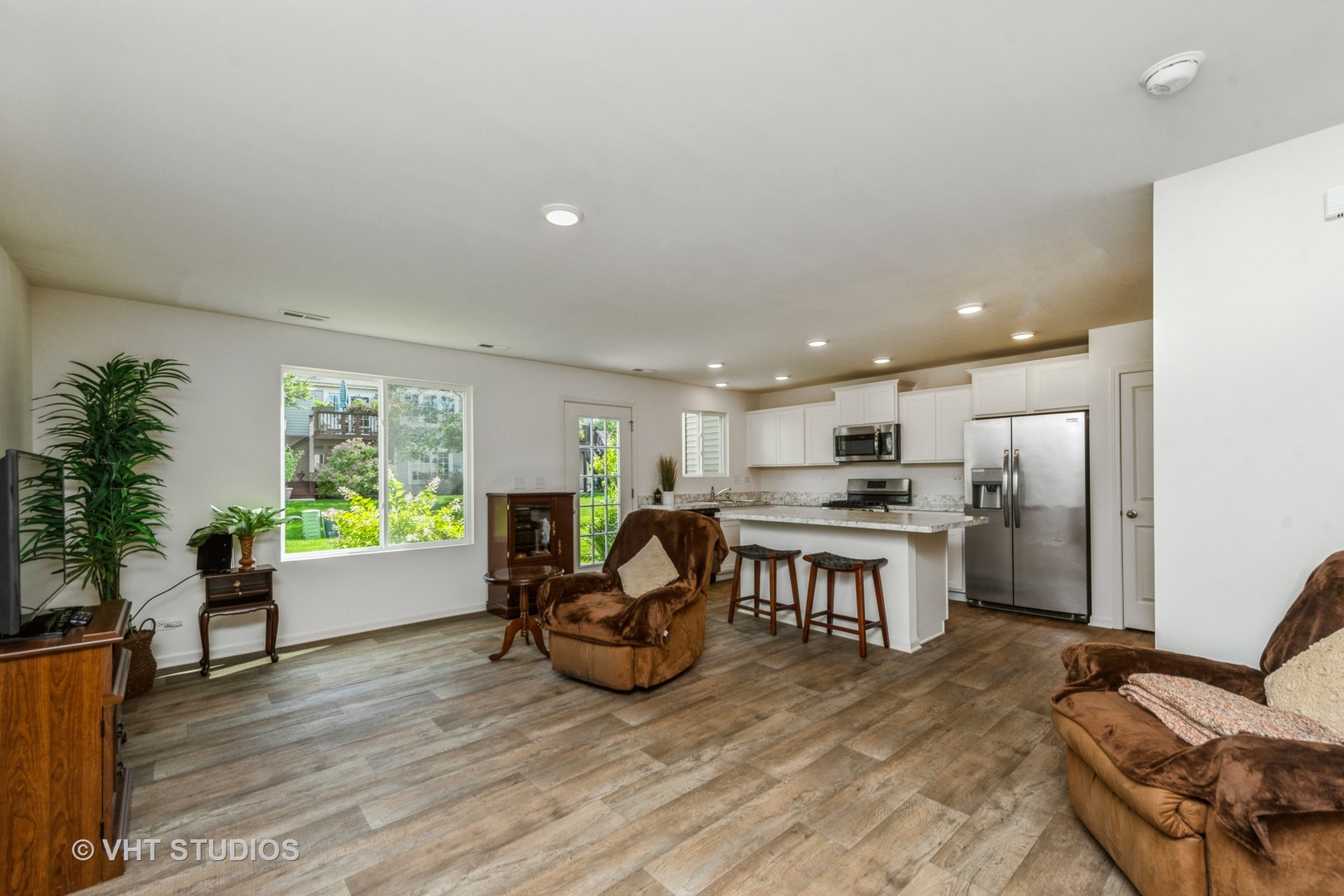 1205 Prairie View Parkway Cary, IL 60013 - Photo 2 of 14 a open kitchen with a table and chairs