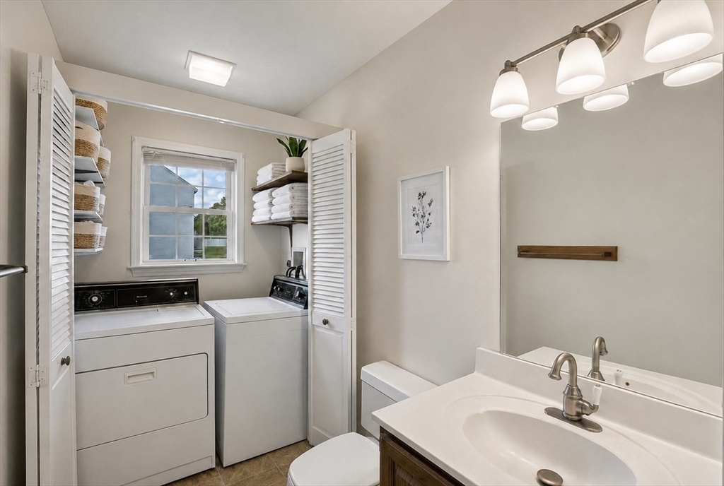 53 Century Way, Unit 53 Gardner, MA 01440 - Photo 11 of 22 a bathroom with a sink a toilet and a mirror