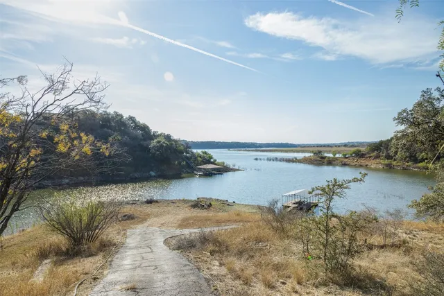 a view of a lake in middle of forest